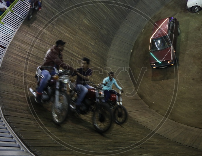 Well Of Death  And Indian Art Of Speed Driving Vehicles  On The Walls Of a Well