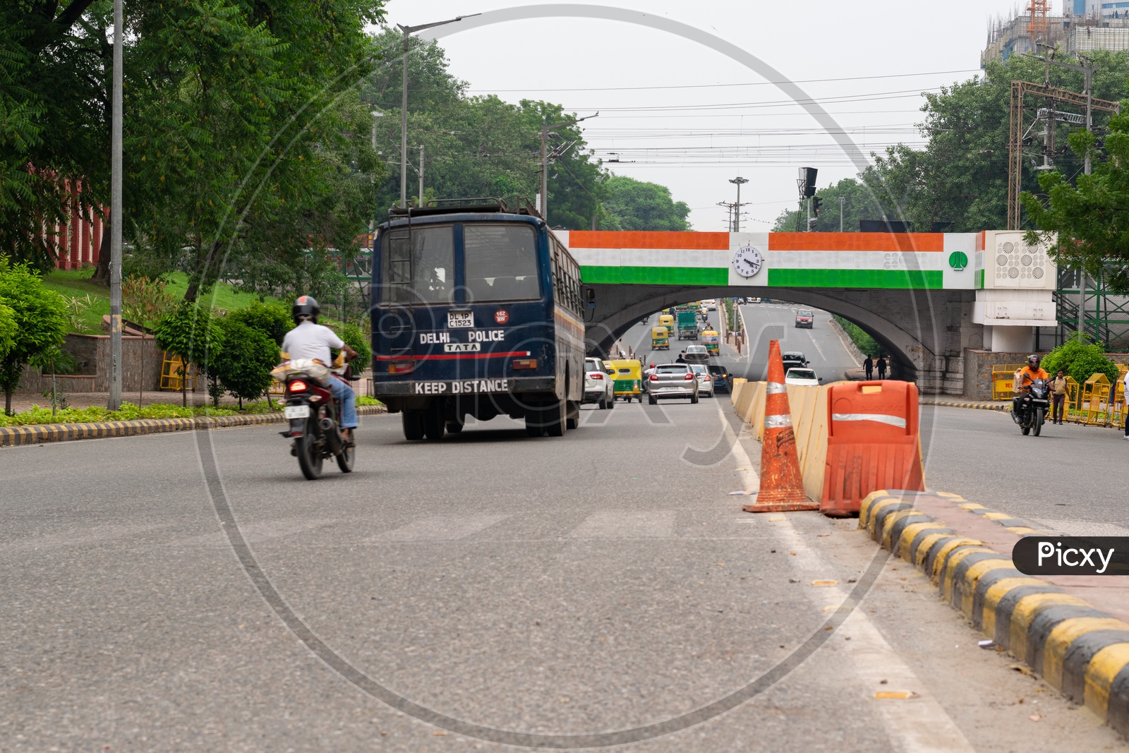 Tricolour (The National Flag of India) painted on a railway bridge above Minto Road and Delhi Police bus