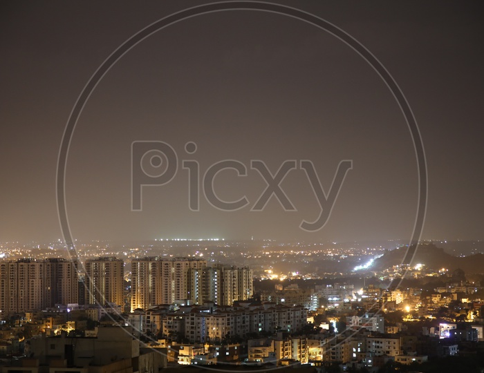 Night Scape Of City Lights With High rise  Buildings Aditya Hill Top