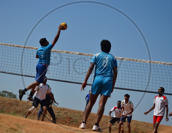Young Indian Men Playing Volleyball