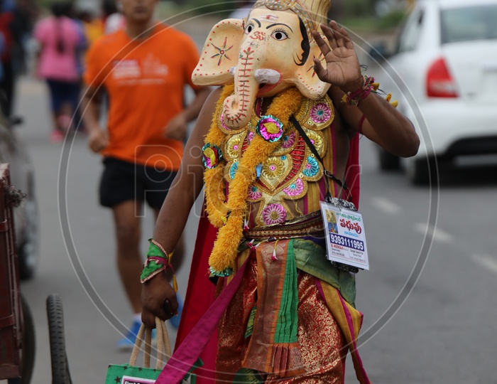 Street Actor Artist Wearing Lord Ganesh Mask On the Streets