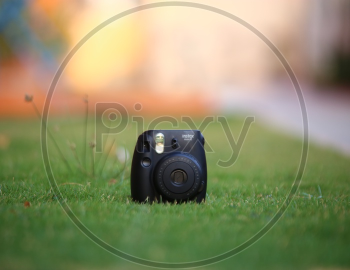 Instax Mini8  Insta Film Cam On Lawn Garden
