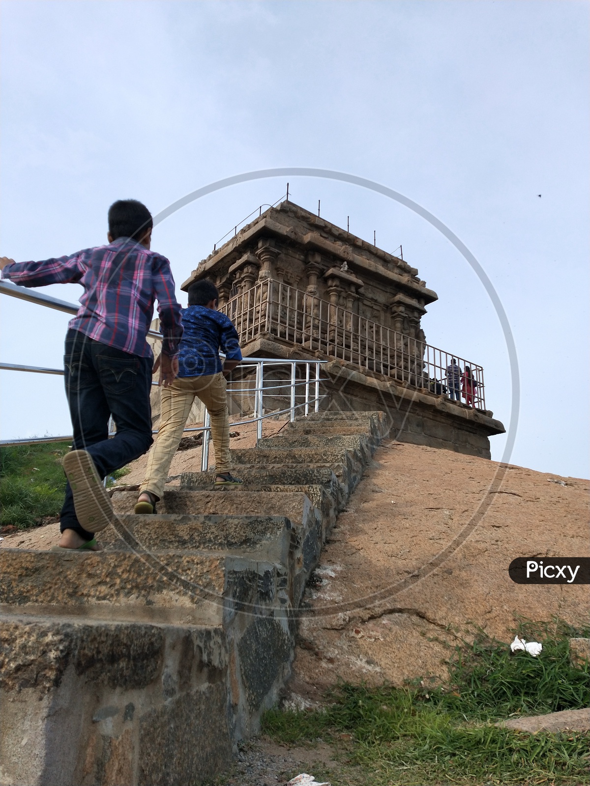 Children running to reach the top of the temple