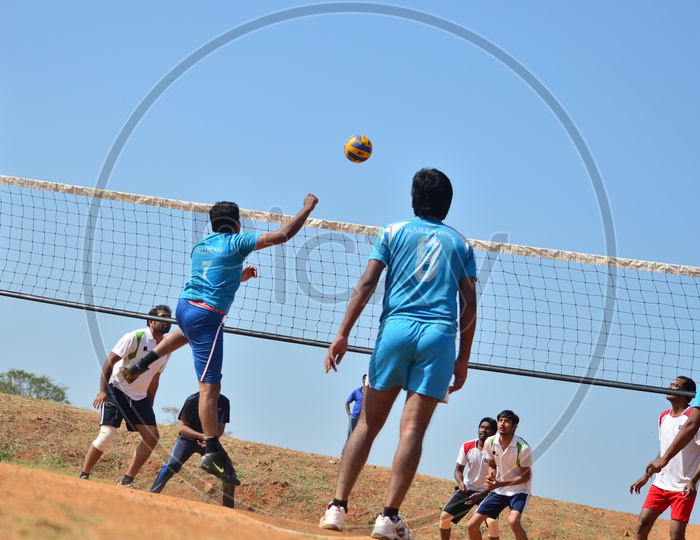 Young Indian Men Playing Volleyball
