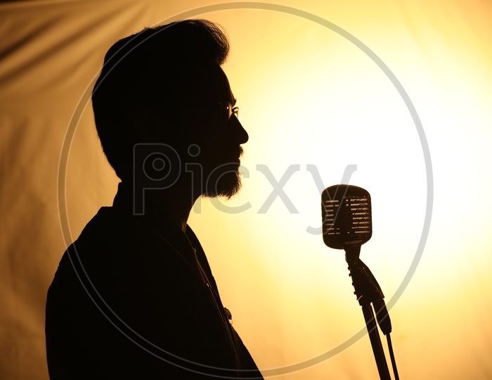 Silhouette of a Male Singer Singing