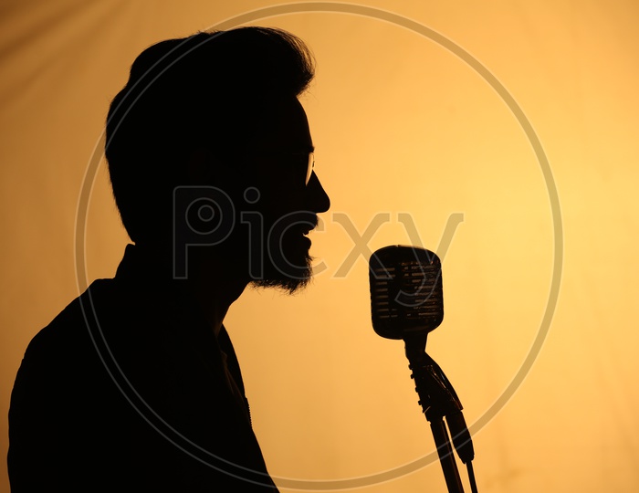 Silhouette of a Male Singer Singing