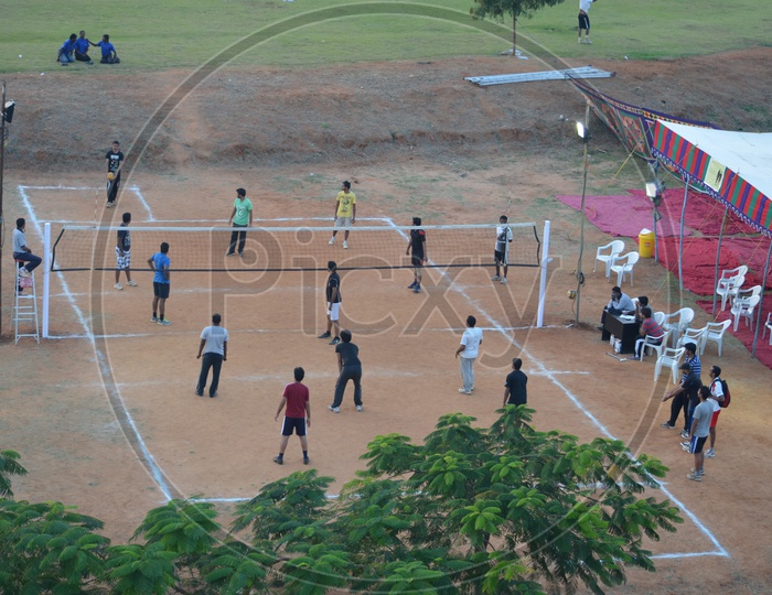 Young Players Students Playing Volleyball  in a College Campus Competition