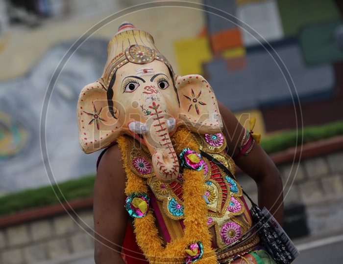 Street Actor  Artist Wearing Lord Ganesh Mask  on The Streets