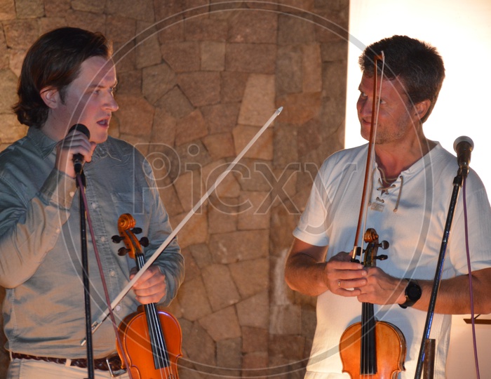 Violin Artists Musicians Performing On Stage