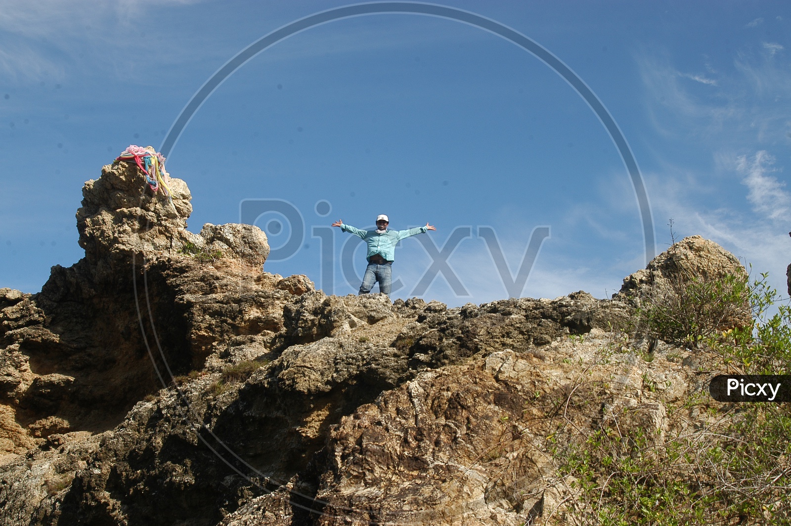 A Man On a Rock Hill