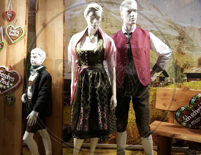 male and female mannequins with branded dress displaying