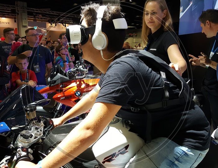 Man using Virtual Reality Headset on BMW Bike
