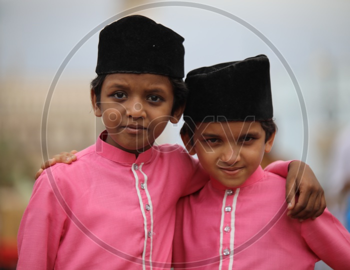 Muslim Kids Wearing  Turban Caps With Smile Faces And Posing  During Ramzan  Ramdan Festival