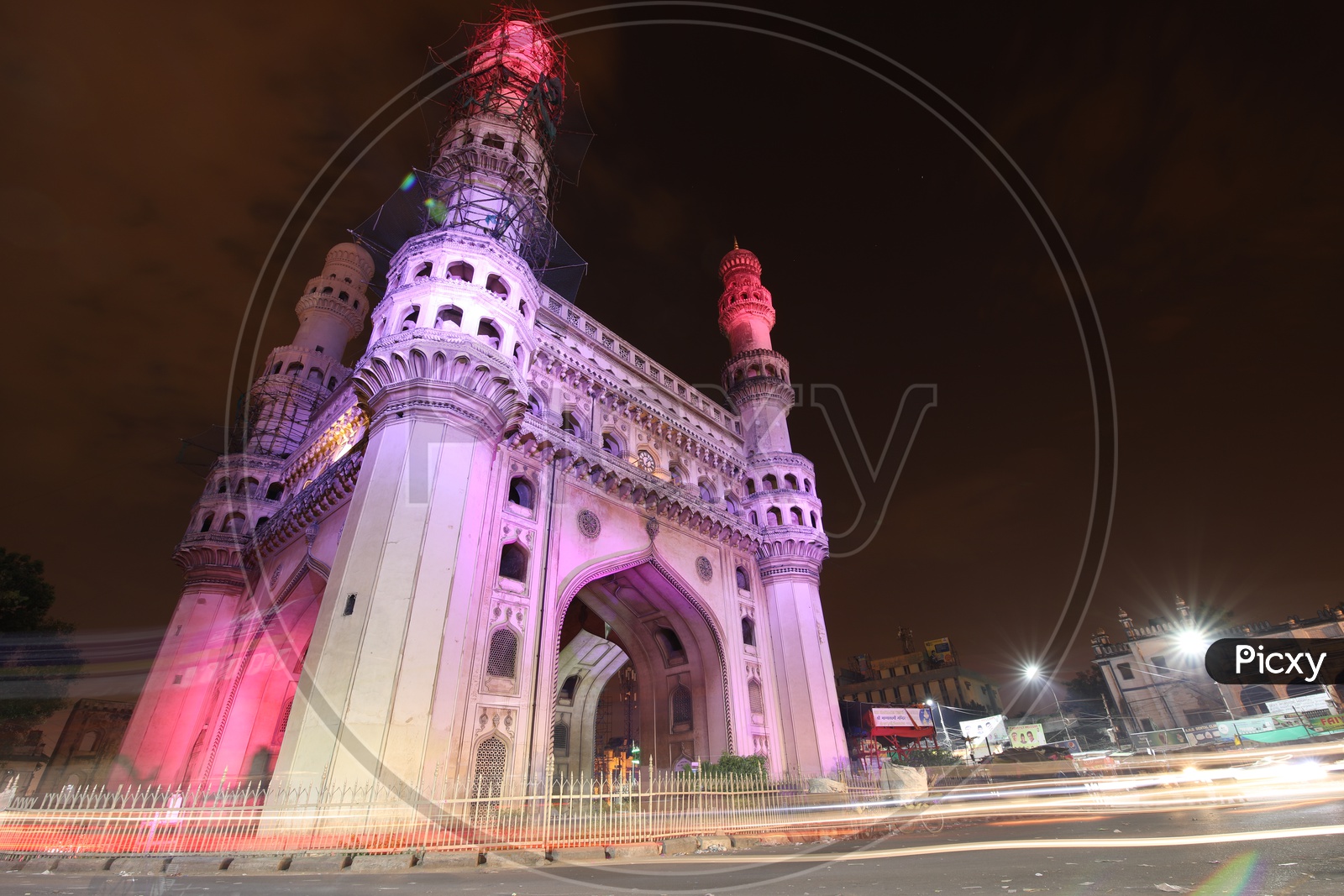 Charminar With Long Exposure of Moving Vehicles Around  The Streets Of Charminar
