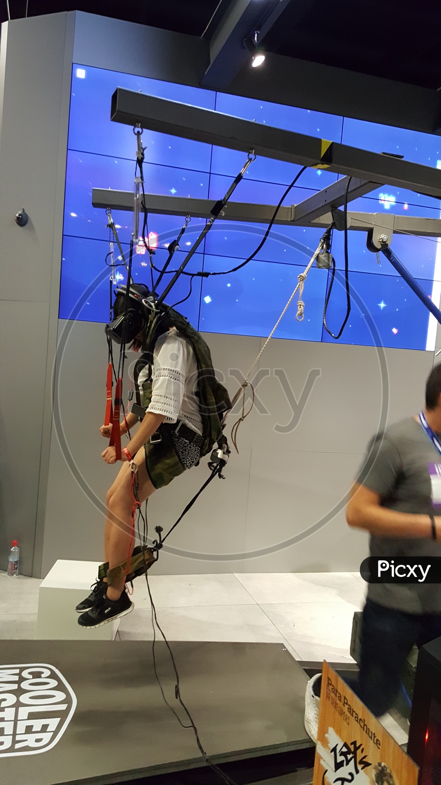 Man using Virtual Reality Headset to do Hang gliding