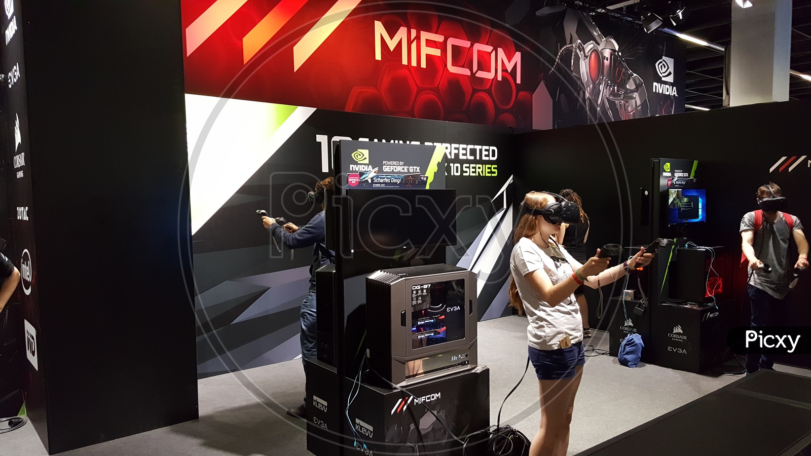 People using MiFCOM Virtual Reality Headsets for Games