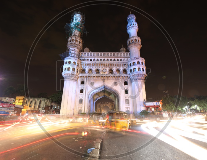 Charminar With Long Exposure of Moving Vehicles Around  The Streets Of Charminar