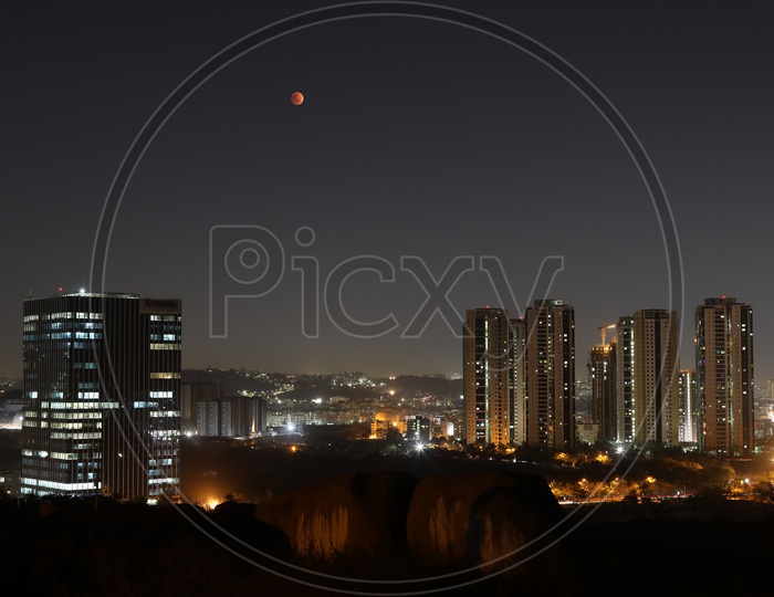Eclipse Moon red Blood Moon Over City Scape  With a View Of Sutherland And Lanco Hills