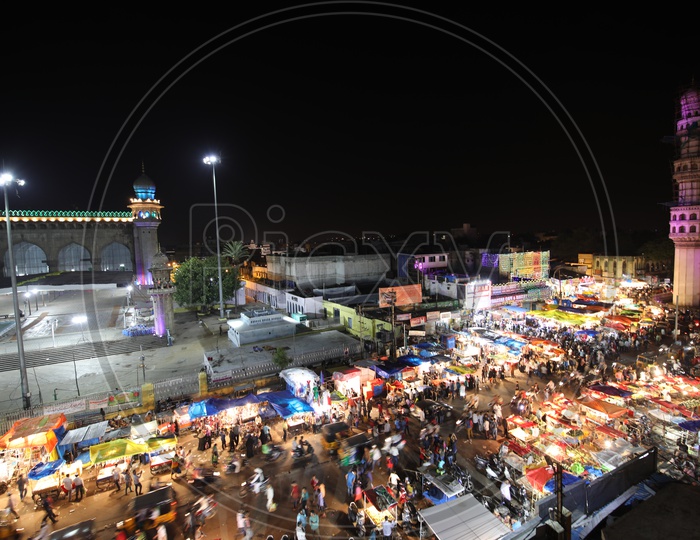 Busy Charminar Streets With Vendor Stalls During Ramzan Ramdan Season With a View Of Mecca Masjid