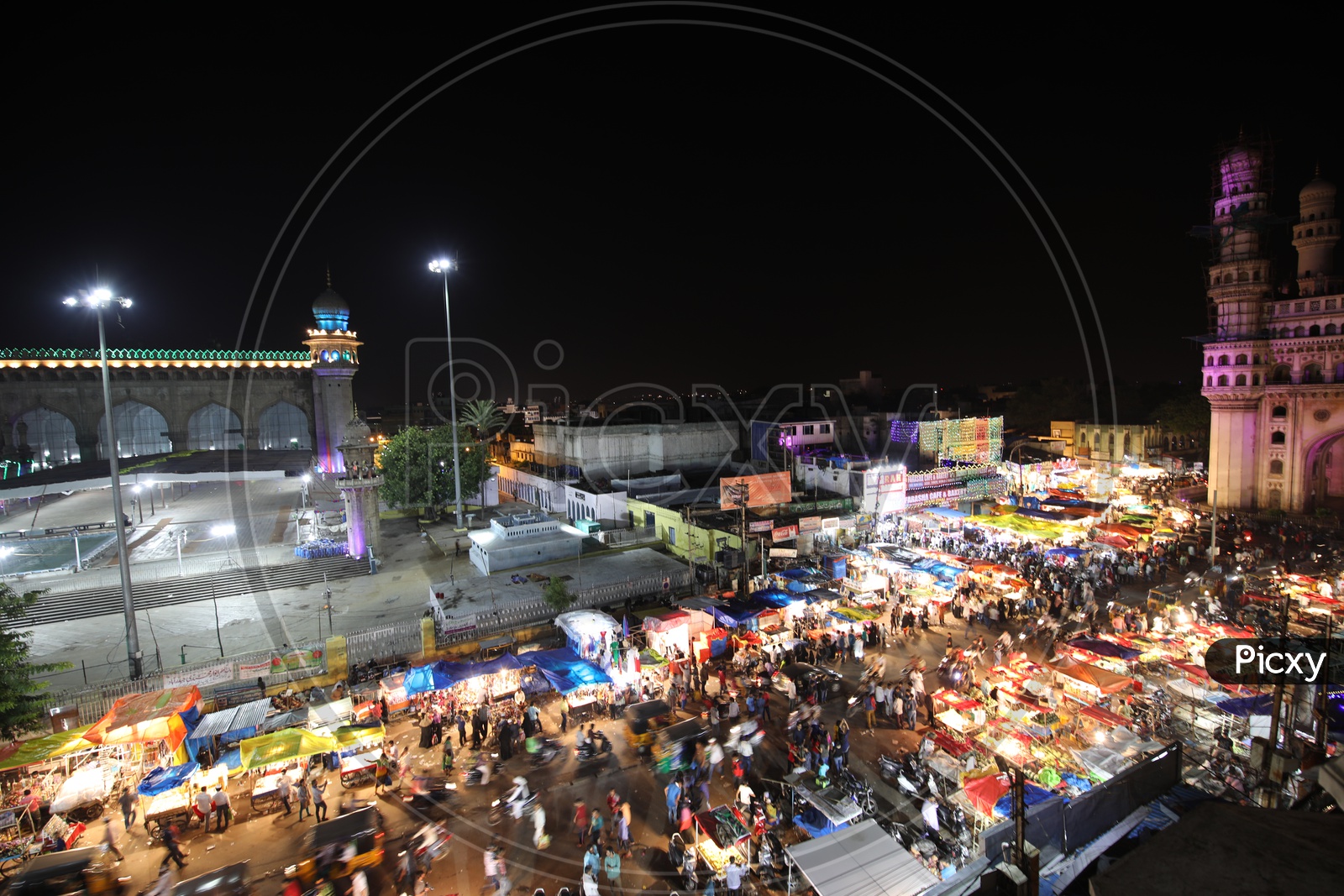 Busy Charminar Streets With Vendor Stalls During Ramzan Ramdan Season With a View Of Mecca Masjid