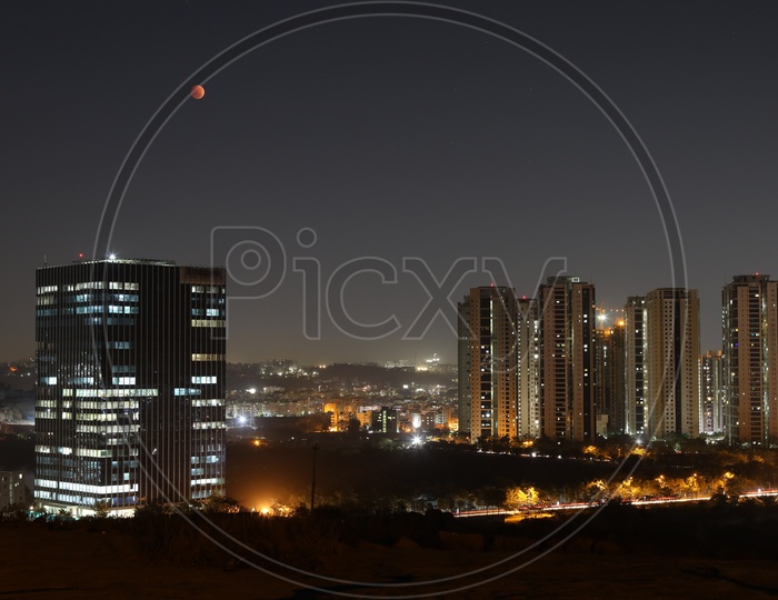 Eclipse Moon red Blood Moon Over City Scape  With a View Of Sutherland And Lanco Hills