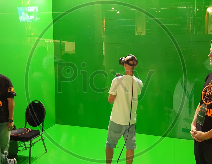 Young Gamer using Virtual Reality Headset to play Games