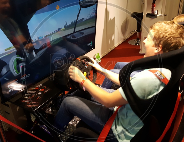 Gamer's using Racing Simulator, Gaming Chair for Playing Games