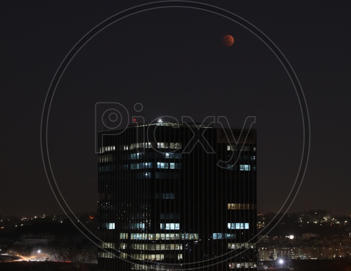 Sutherland Building Facade With A View of Eclipse Moon  in Sky
