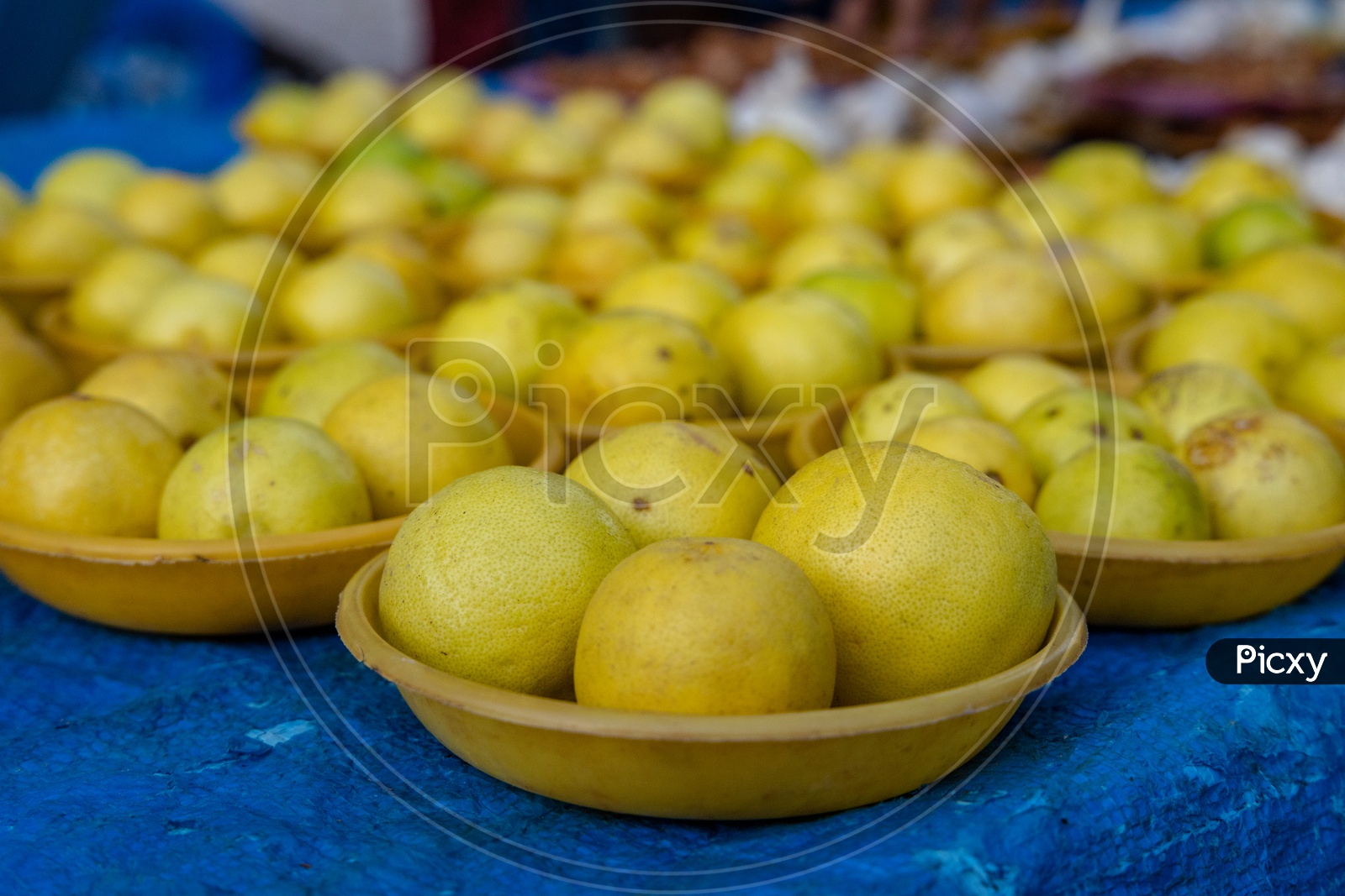 Lemons In Bowls  In a Vegetable Vendor Stall