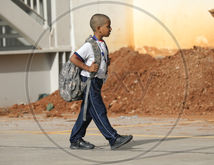 School Students Children Carrying heavy Weight Bags