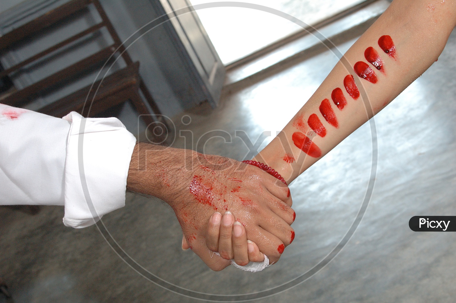Lovers holding Hands With Blood Stains