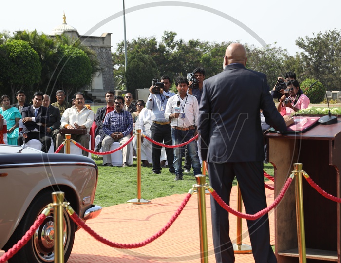 Image of Indian Man Speaking At Dias At a Car AuctionMV237667Picxy
