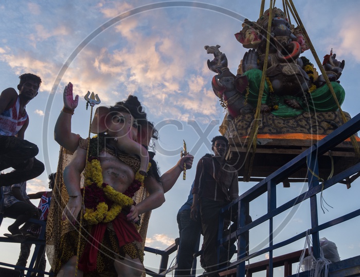 Ganesh idols being taken for immersion