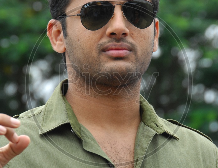 Image of Actor Nithin Movie Working Stills with scarf-KZ029690-Picxy