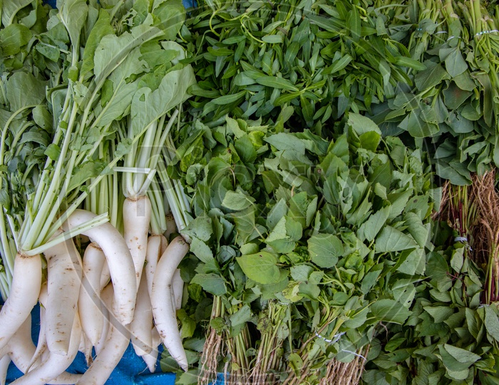 radish and green vegetables in a Vendor Stall