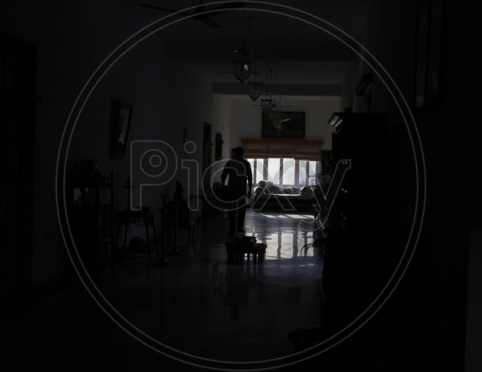 Silhouette Of  a Man In a House Corridor