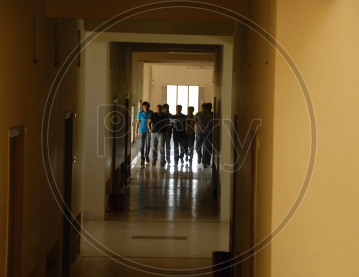 People In A Hostel Corridor