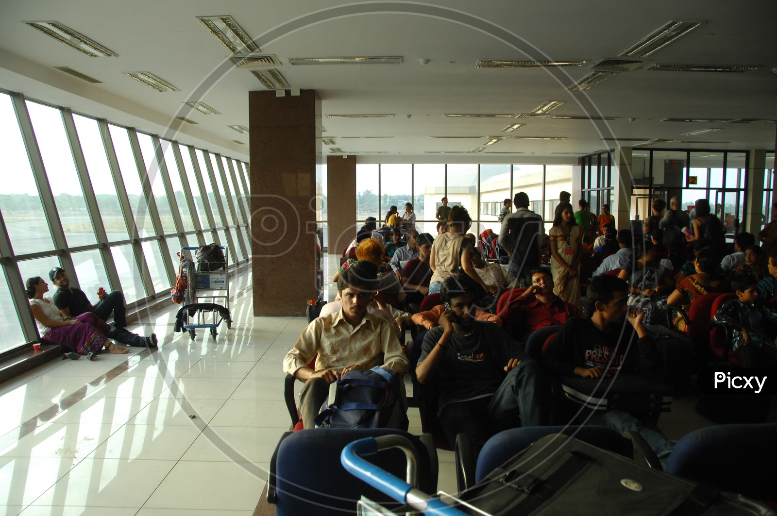 Passengers Waiting In an Airport Waiting Lounge