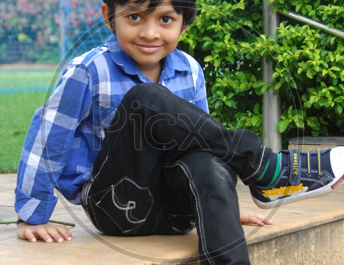 Indian Young Boy With an Expression On Face And Posing On Outdoor