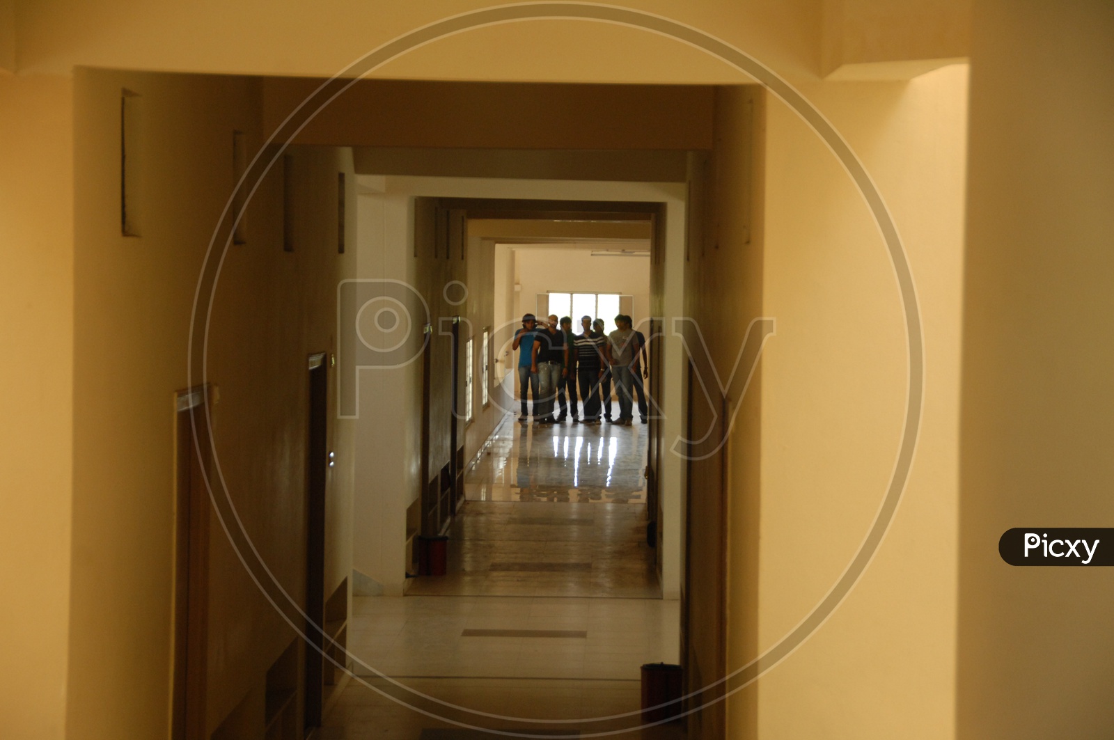 People In A Hostel Corridor