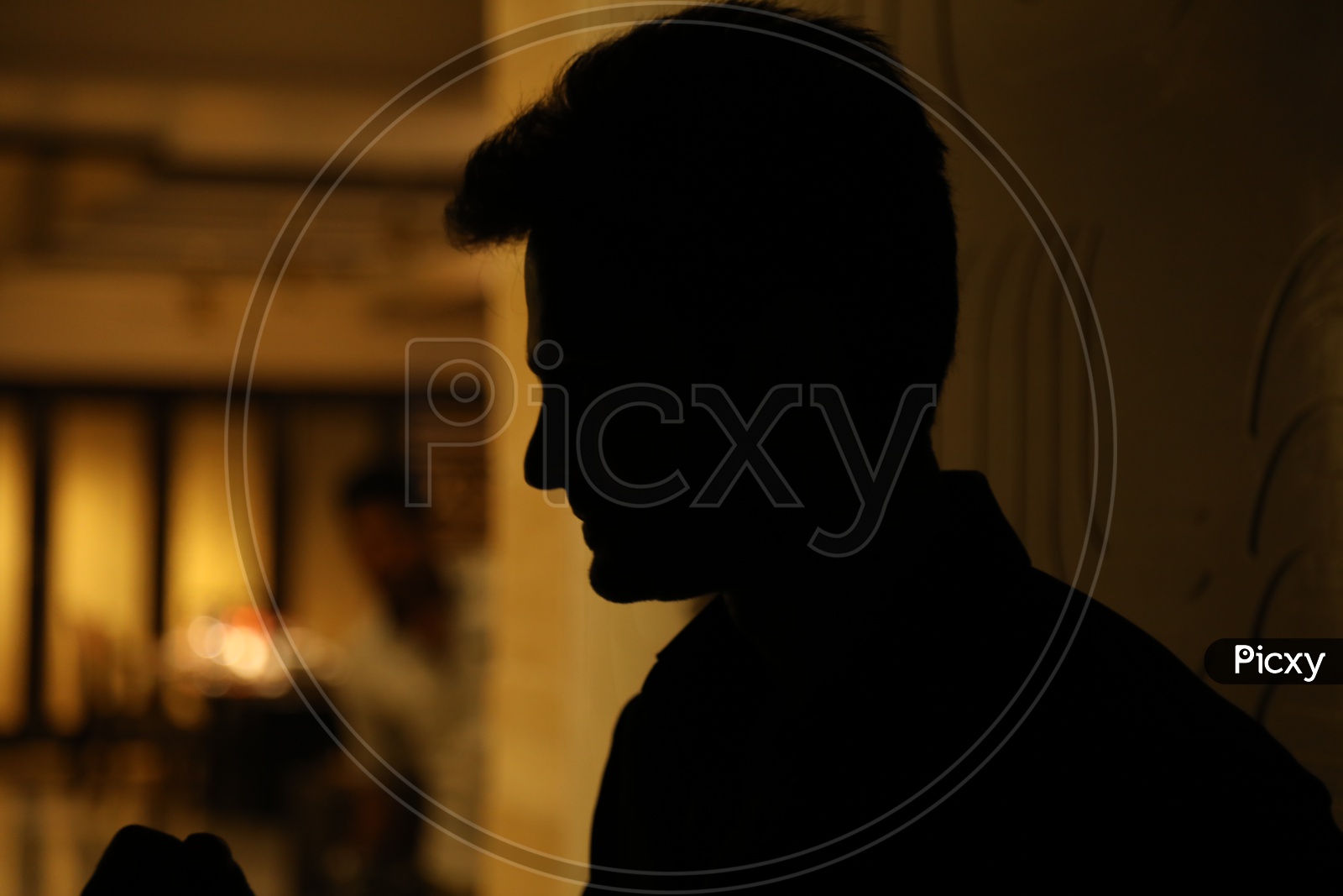 Silhouette of a Man in a House Corridor