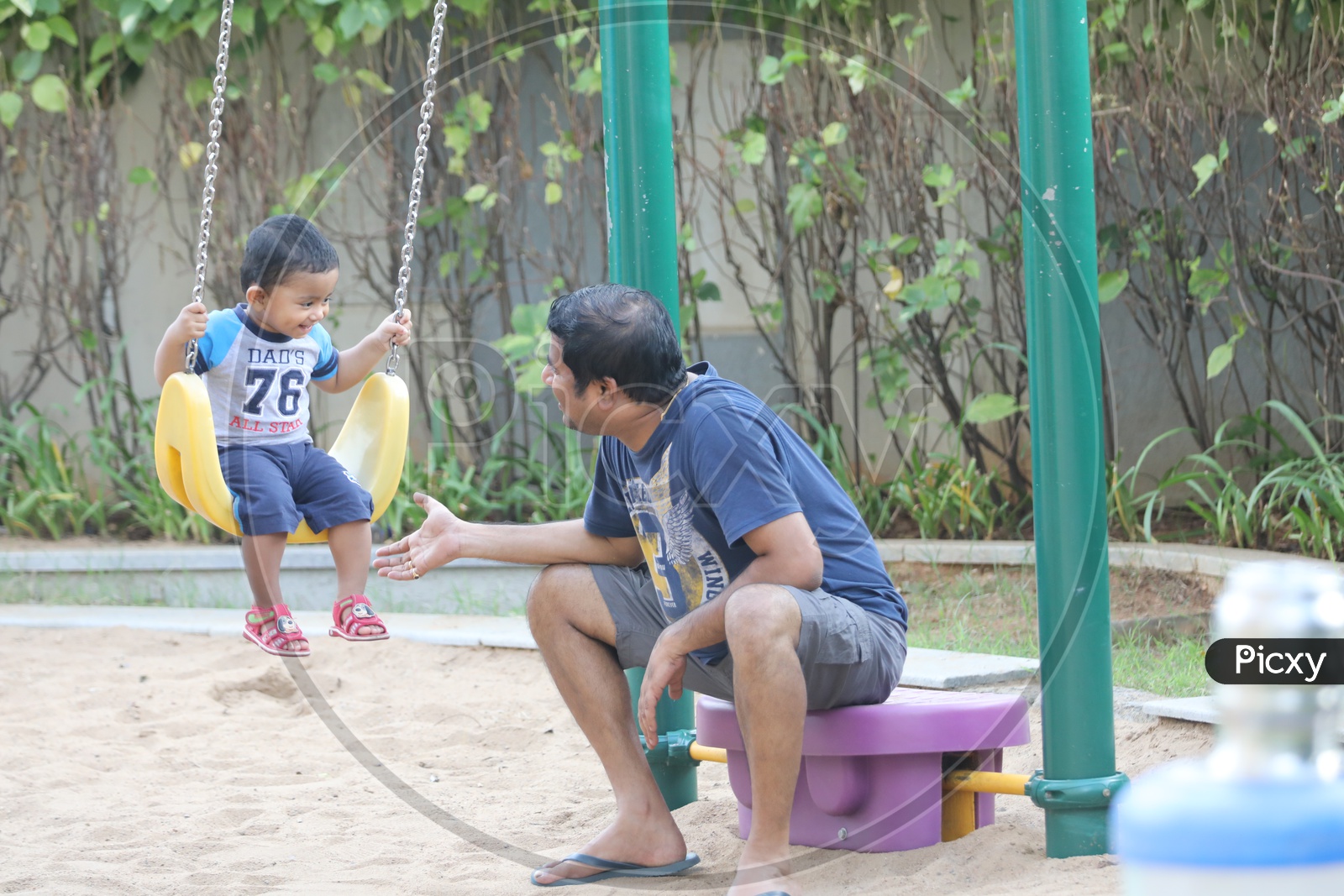 Father Parents Playing With Children In a Park