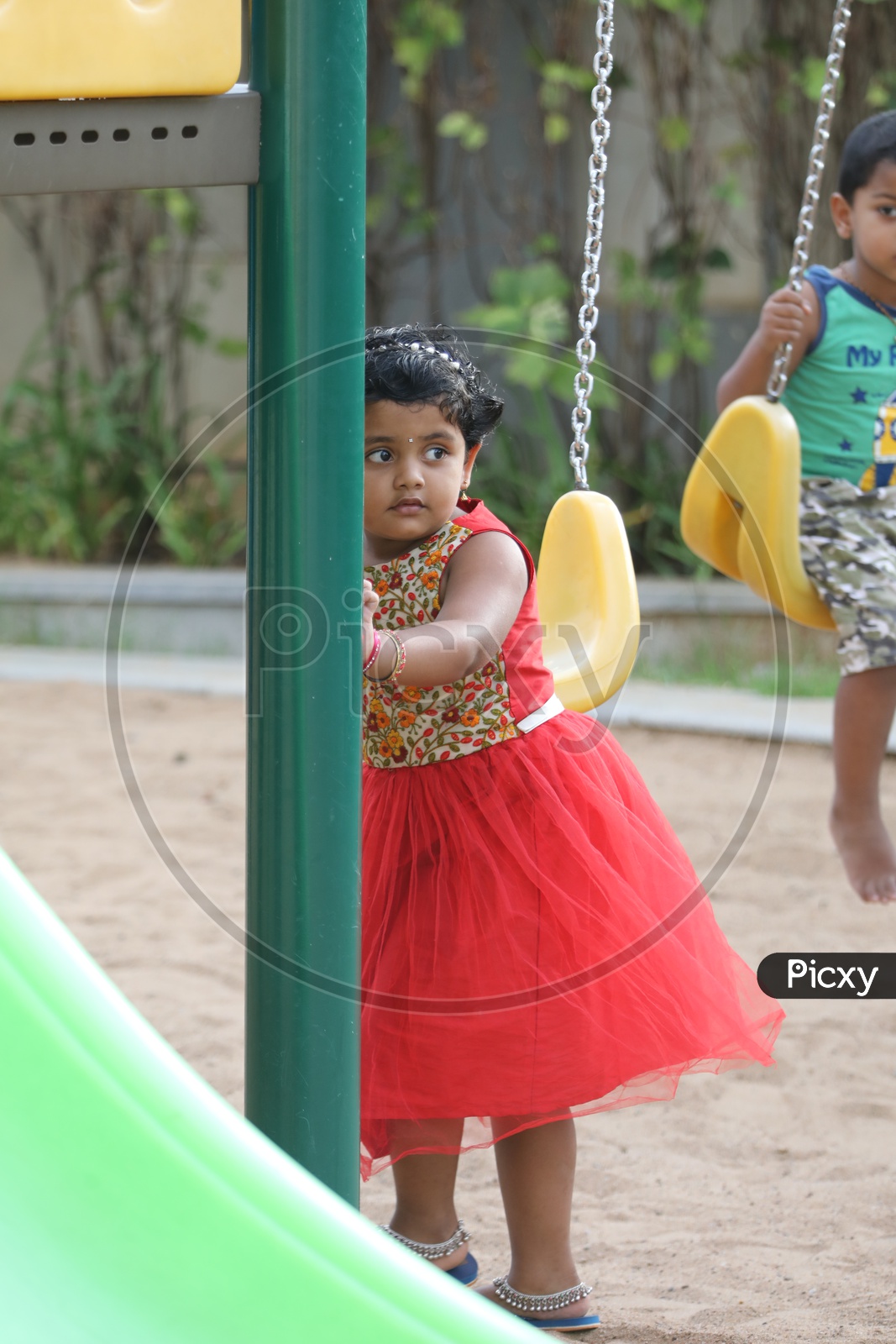 Indian Girl Child Playing In a Park
