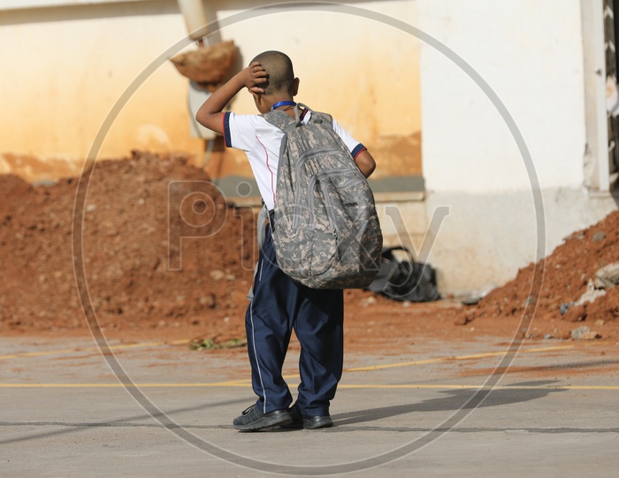 School Students Children Carrying heavy Weight Bags