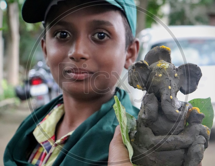 Children Making Clay Ganesha
