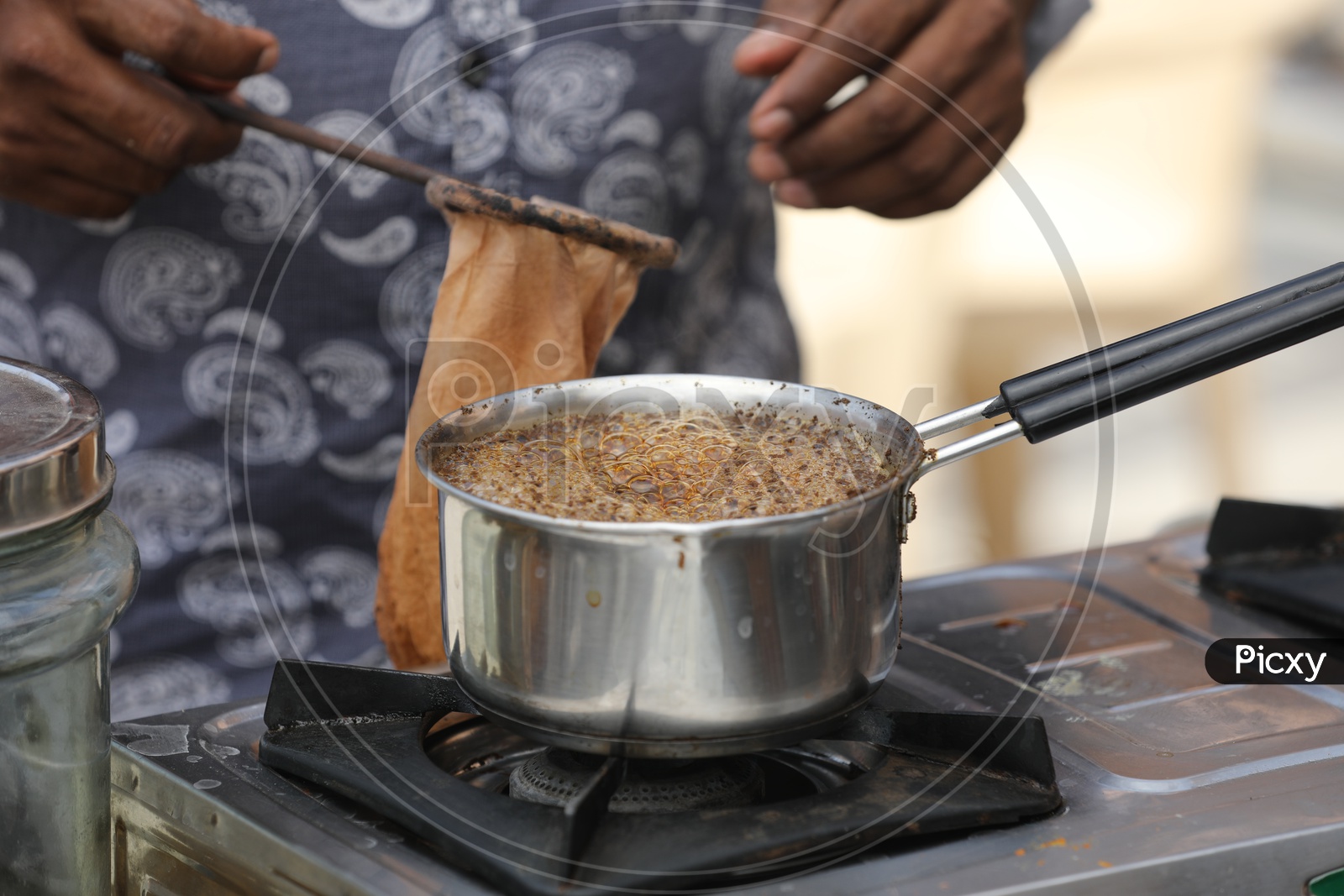 Tea Being Boiling In A Vessel At Tea Vendor Stall Or Chai Stall