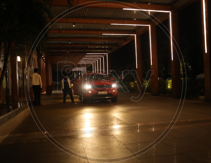 A Car Entering to  a Lobby Of a Hotel Or Residency
