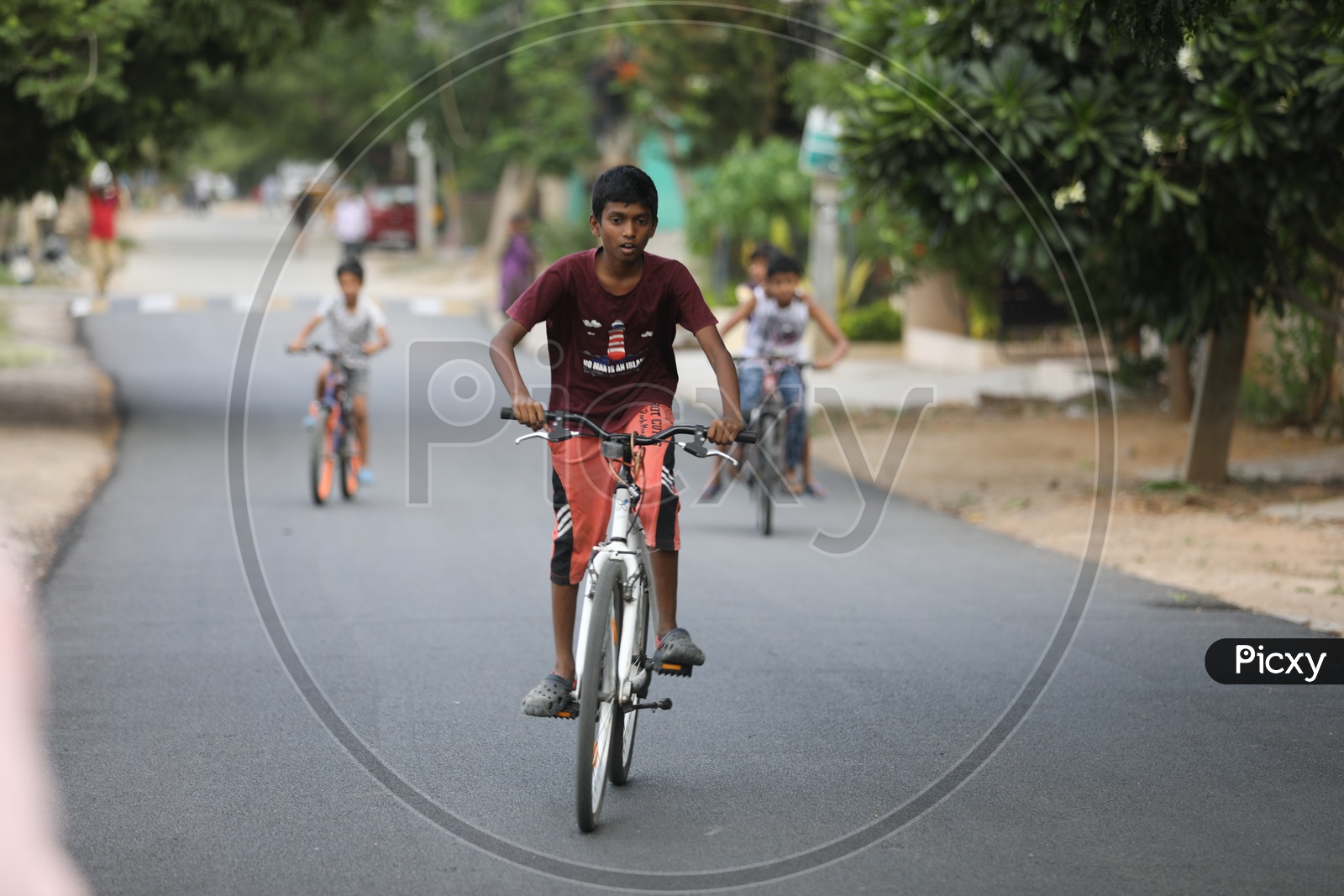 Indian Rural Village Kids Or Children Riding Bicycles Or Cycles on The Roads