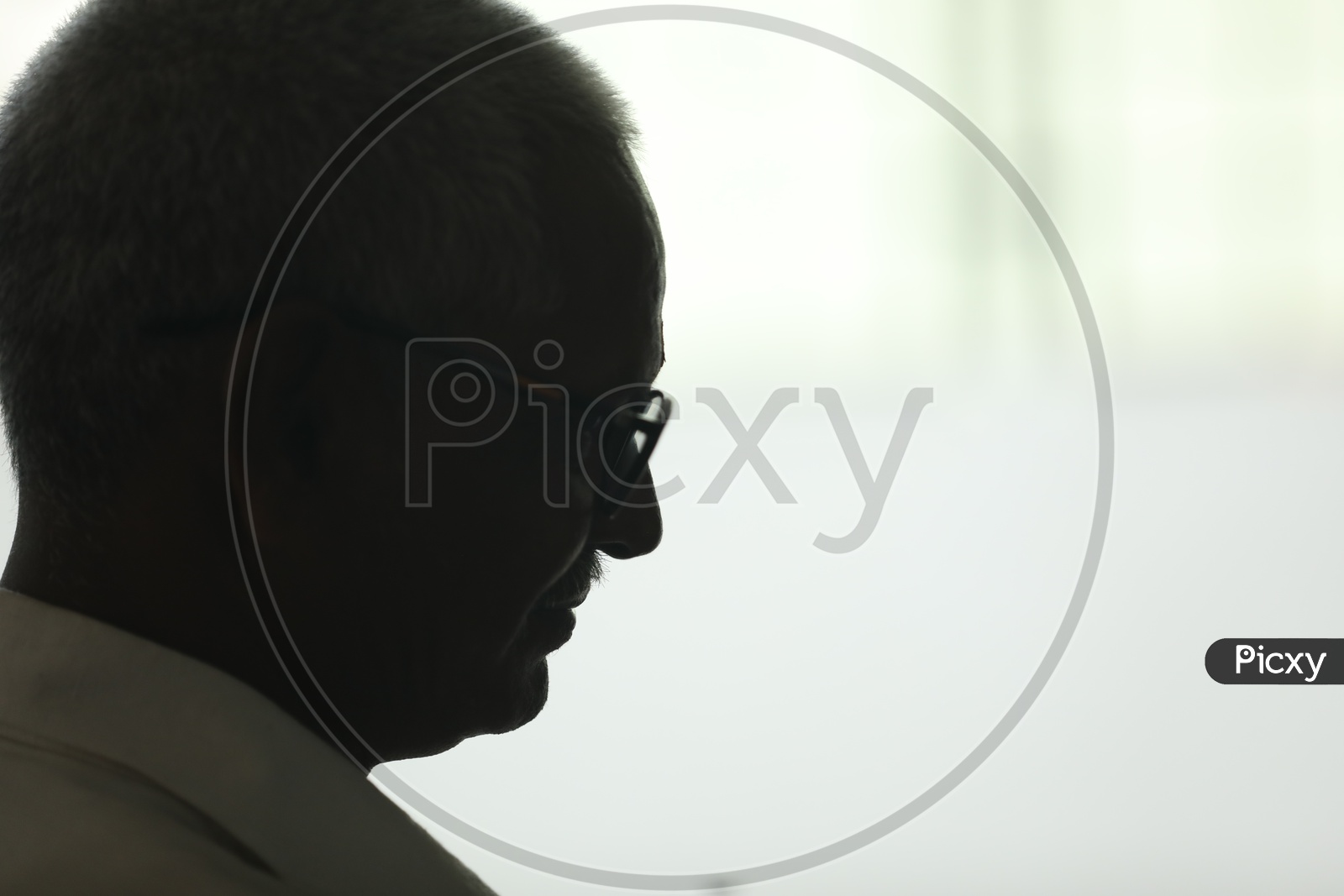 Silhouette Of a Thinking Indian Old Man Wearing Spectacles