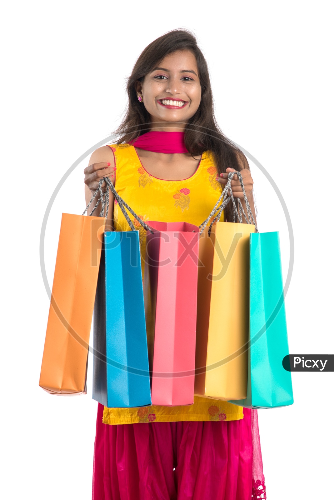 Young Indian Woman Or Girl Happily Smiling With Shopping Bags On an Isolated White background